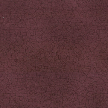 Textured burgundy fabric pattern
